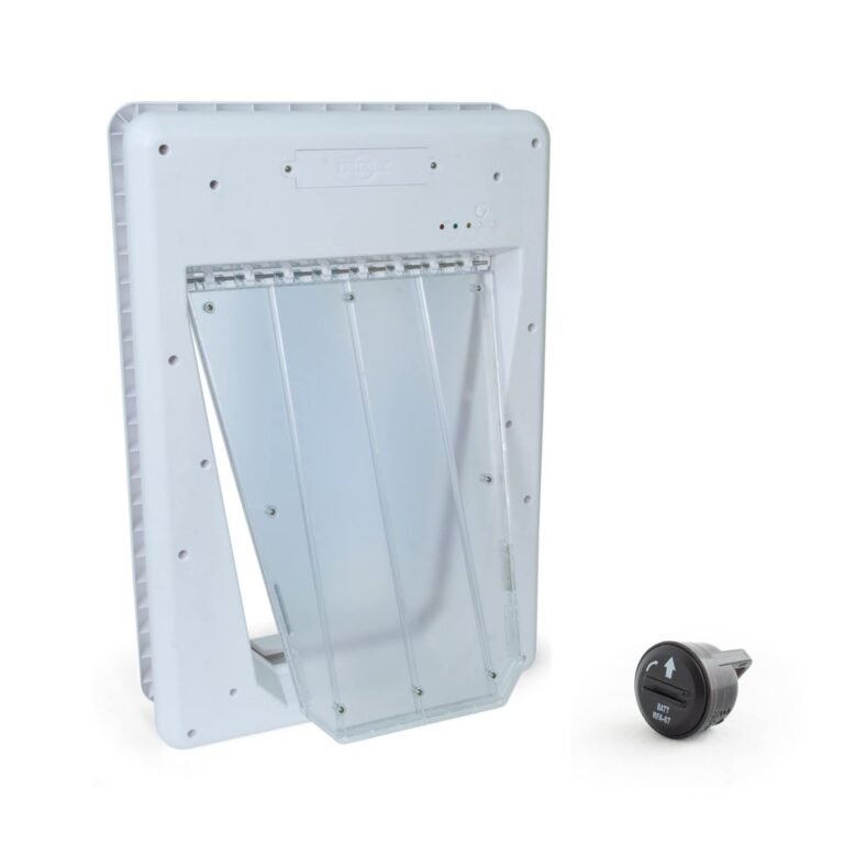 White pet door with clear flap and a black battery-operated key