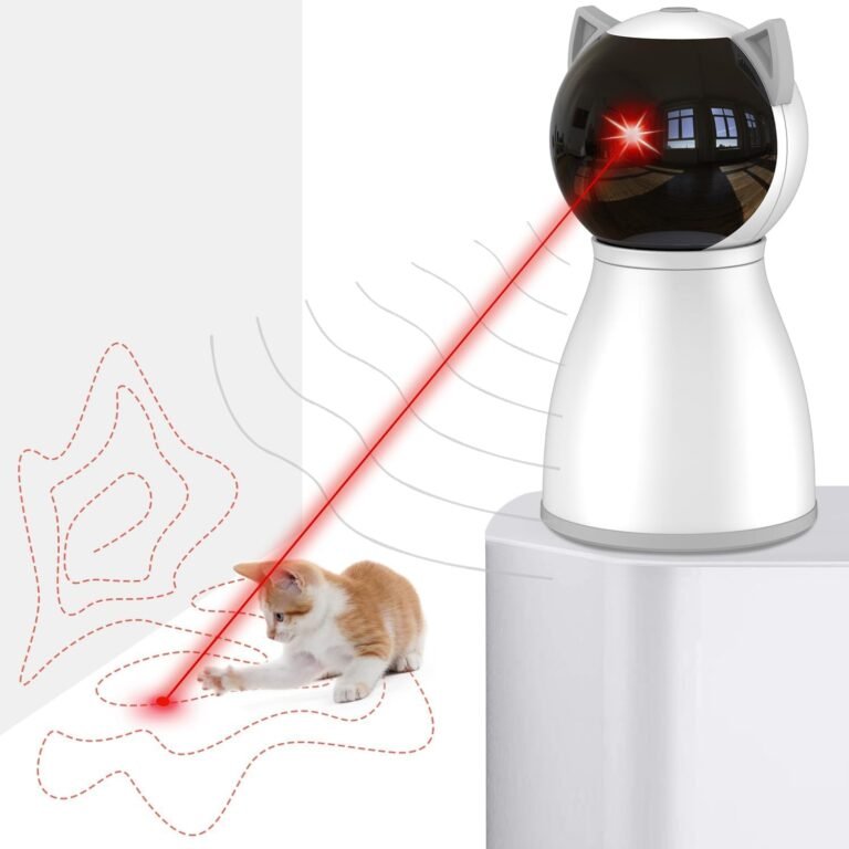 A cat playing with a laser pointer toy shaped like a cat