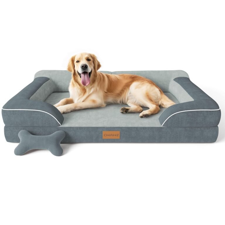 Golden retriever dog lying on a gray dog bed with bone pillow