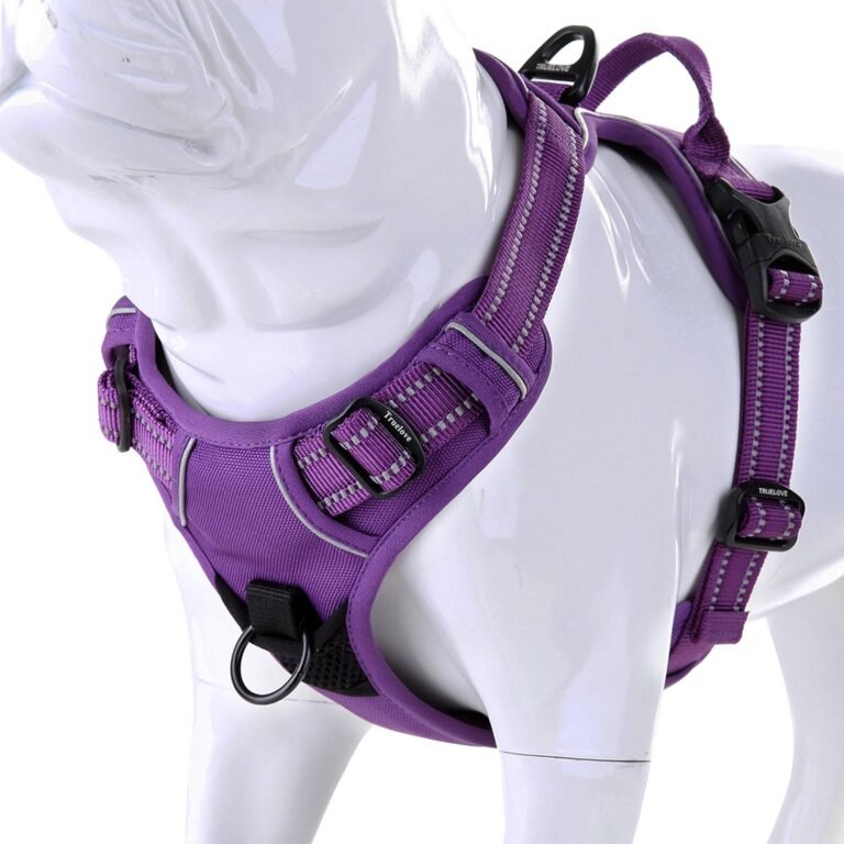 Purple dog harness on a white mannequin, with reflective trim and buckles