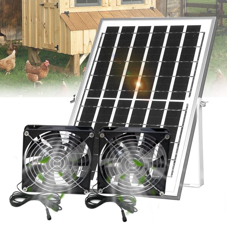 Solar panel with fans, chicken coop, and chickens in a grassy yard